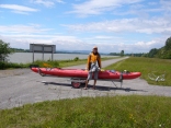Kelsey pauses for a photo op with the kayak on a carrier similar to what is found at every large dam in Germany and Austria.